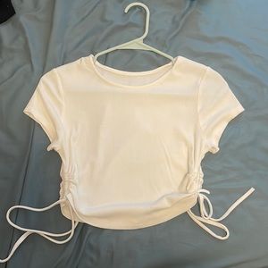White cropped tee with ties on both sides. size small. worn once.